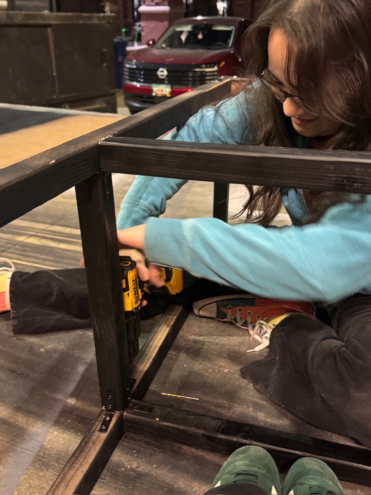 Assembling the wooden frame for the exhibit stand
